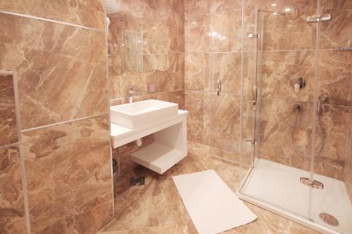 a bathroom with a sink and a shower at Apartments Belgrade in Belgrade