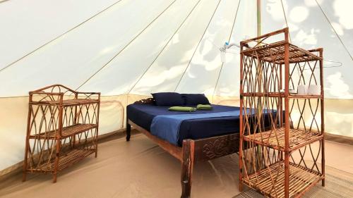 a bedroom with a bed in a tent at SunBoo Beach Bungalows in Koh Rong Sanloem