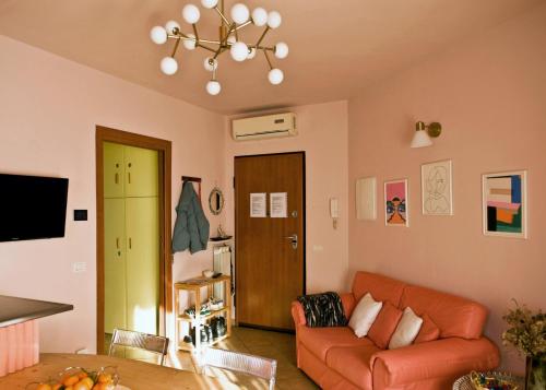 a living room with a couch and a table at Apartment with Garden in Romano di Lombardia