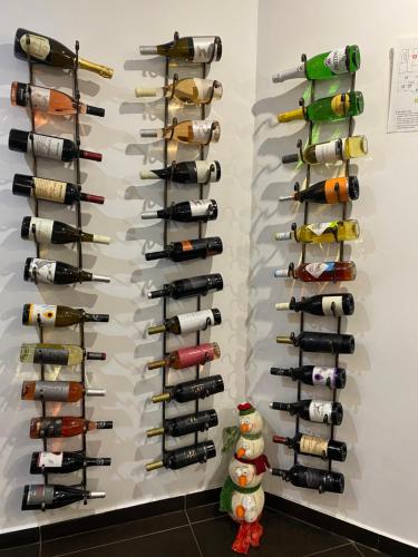 a wall full of wine bottles at Park Hotel Fairy in Chiflik