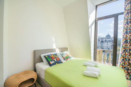 Giường trong phòng chung tại Central Luxury Living Europe Square,Balcony/Batumi