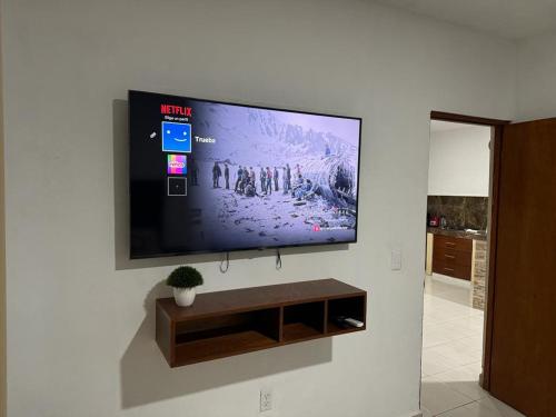 a flat screen tv hanging on a wall at NUEVA Casa Tipo Departamento Totalmente Climatizado in Tampico