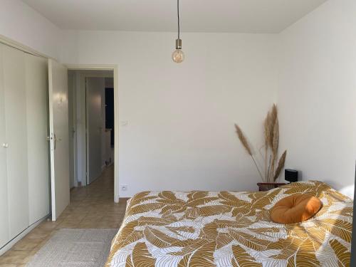 Postel nebo postele na pokoji v ubytování T2 cosy avec espace extérieur