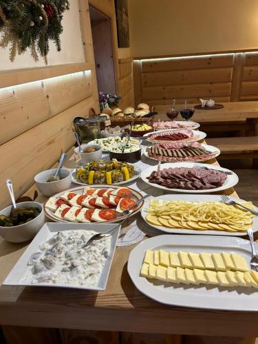 a table topped with lots of different types of food at u Lucyny w Białce Tatrzańskiej in Białka Tatrzańska