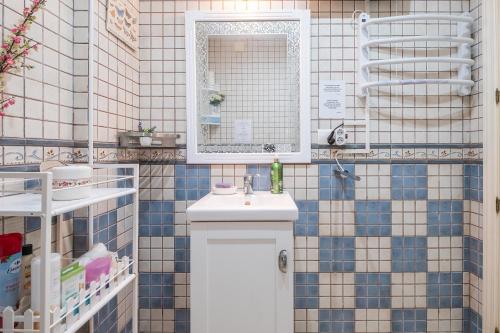 a bathroom with a white sink and a mirror at Villa Jacaranda in Cala del Moral