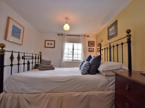 a bedroom with two beds and a window at 2 Bed in Polruan PC042 in Fowey