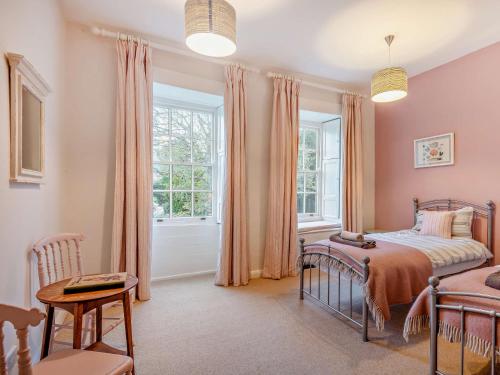 a bedroom with a bed and a window at 4 Bed in Snettisham KT124 in Snettisham