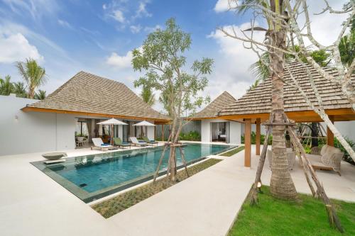 an image of a villa with a swimming pool at Spacious Mansion 4BR Villa Anchan V20 with 15m Private Pool in Gated Residence in Bang Tao Beach