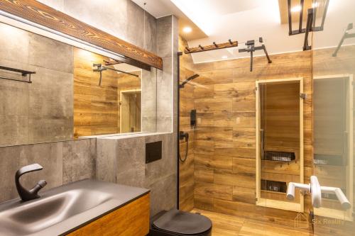 a bathroom with a sink and a shower at Apt. Plešivec in Abertamy