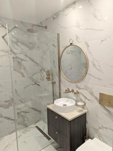 a bathroom with a sink and a mirror at Twenty Nevern Square Hotel in London