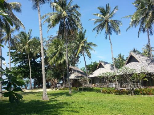 a view of a resort with palm trees at New Ozone Resort & Spa in Ko Lanta