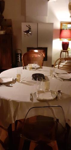a table with a white table cloth on top of it at grande terrasse avec vue entre méditerranée et pays cathare in Cailla