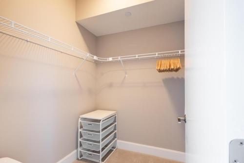 a room with a closet with a dresser at Reston 1br w swimming pool nr bars dining WDC-835 in Reston