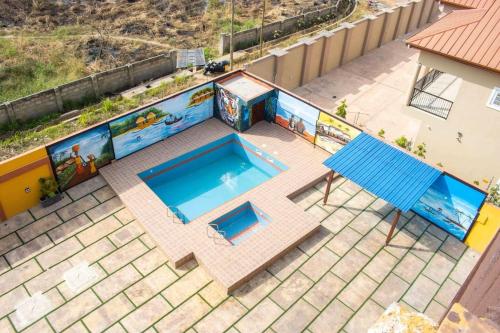 an overhead view of a swimming pool on a house at Fully Furnished 1- Bedroom in East Legon in Madina