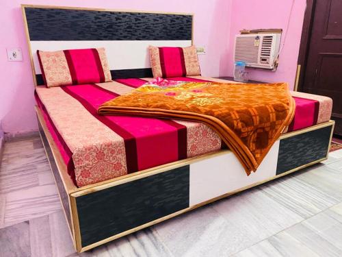 a large bed in a room with at Hotel Best Stay By Hariganga Haridwar in Haridwār