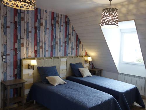Un pat sau paturi într-o cameră la Maison de la Presqu'île - 4 chambres avec Vue Mer