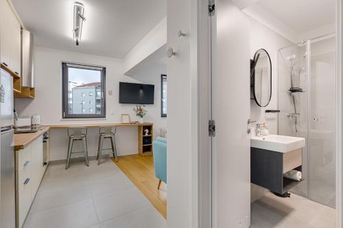 a bathroom with a sink and a counter at Tres Fenestras Zadar - private parking in Zadar