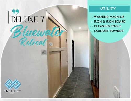 a hallway with a door and a sign that reads blueknife retreat at Roxy Sematan Beach Townhouse Deluxe 7 ,8 ,9, 10 ,11 ,12 in Sematan
