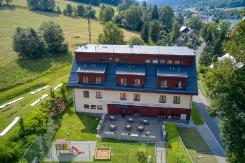 an aerial view of a large building on a hill at Hotel Toč in Lipova Lazne