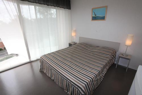 Postel nebo postele na pokoji v ubytování Plage Centrale