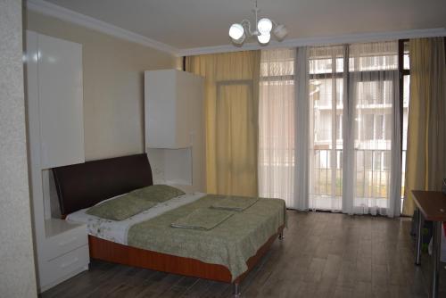 מיטה או מיטות בחדר ב-Giga Guest House