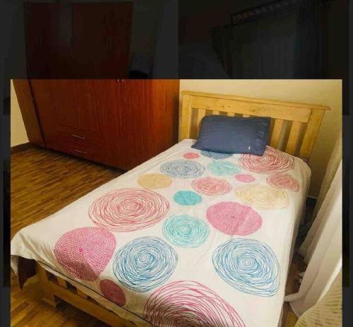 Cama o camas de una habitación en Katabi Apartment Entebbe