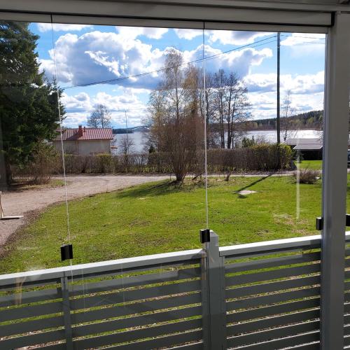 a view of a yard from the window of a house at Seeblickferienhaus in Lahti