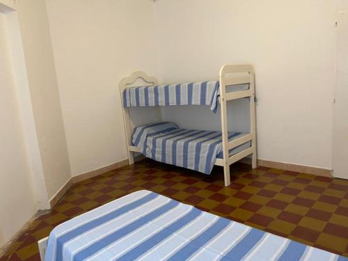 Ένα ή περισσότερα κρεβάτια σε δωμάτιο στο Buen pasar