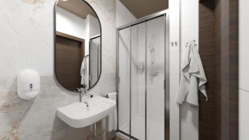a white bathroom with a sink and a mirror at Hotel Termy Pałacowe in Nałęczów