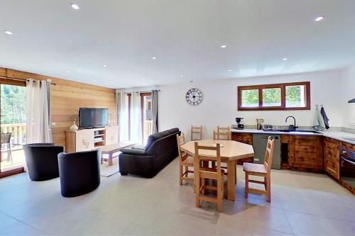 a kitchen and living room with a table and chairs at CASA-Bruno family chalet Queyras 7p in Aiguilles