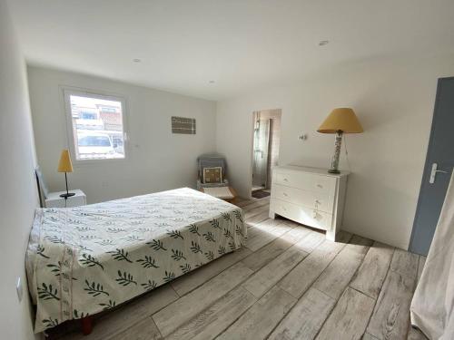 En eller flere senge i et værelse på Maison de vacances en front de mer