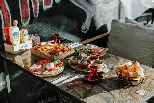 a table topped with plates of food on a table at Concept Royal Edirne in Edirne