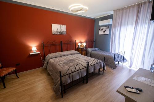Posteľ alebo postele v izbe v ubytovaní Room 112 Oltremare