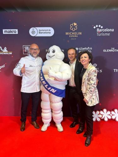 a group of people on a red carpet with a mascot at Migjorn Ibiza Suites & Spa in Playa d'en Bossa