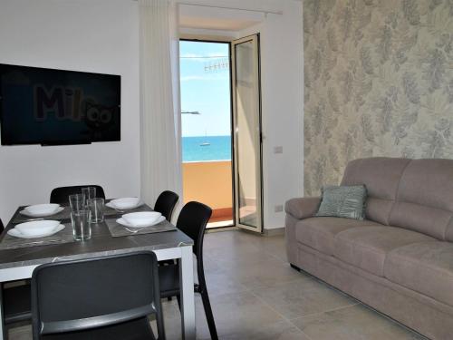 a living room with a table and a couch at Apartment Brezza di Mare by Interhome in Formia