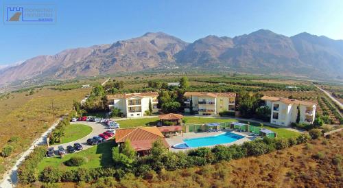 an aerial view of a house with a swimming pool at Monachus Monachus in Frangokastello