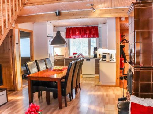 a kitchen and dining room with a table and chairs at Holiday Home Lampitaival 6b by Interhome in Kotila