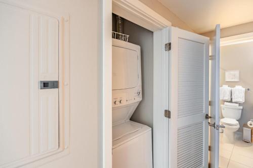 a bathroom with a washer and dryer at Reston studio w biz center nr hospital bars WDC-829 in Reston