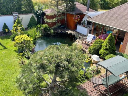 an aerial view of a garden with a pond at Holiday Home Vrbová Lhota U Aničky by Interhome in Vrbová Lhota