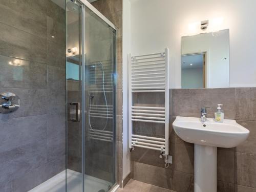 a bathroom with a sink and a shower at 2 Bed in Croyde 76783 in Croyde