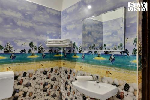 a bathroom with a sink and a painting on the wall at StayVista's Palm Perle Villa - Pet-Friendly Retreat with Terrace, Lawn & Pool Table in Bhopal