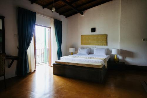 Postel nebo postele na pokoji v ubytování Kaya Residence Kandy