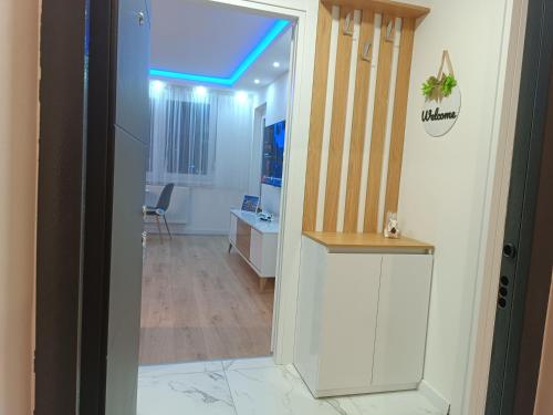 an open door to a room with a desk and a room with a desk at Apartman ''Airplane'' Sarajevo in Sarajevo