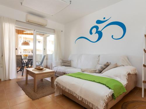 a living room with a bed and a couch at Apartment Om by Interhome in Vinaròs