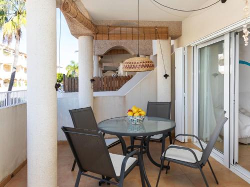 a dining room with a table and chairs at Apartment Om by Interhome in Vinaròs