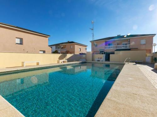 a swimming pool in front of a building at Holiday Home Wunder Haus by Interhome in Vinarós