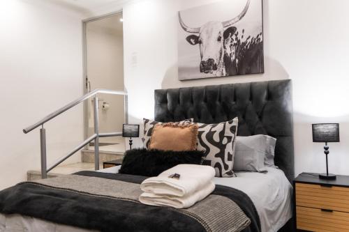 מיטה או מיטות בחדר ב-Waterfront Boutique Hotel Vanderkloof