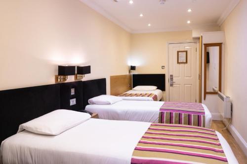Athena Hotelにあるベッド