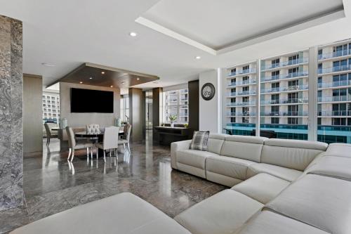 a living room with a couch and a dining room at LUXURY PENTHOUSE ON THE BEACH 3/3 OCEANFRONT CONDO in Hollywood