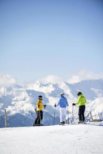 a group of three people on skis in the snow at Hotel Schölzhorn Superior in Racines